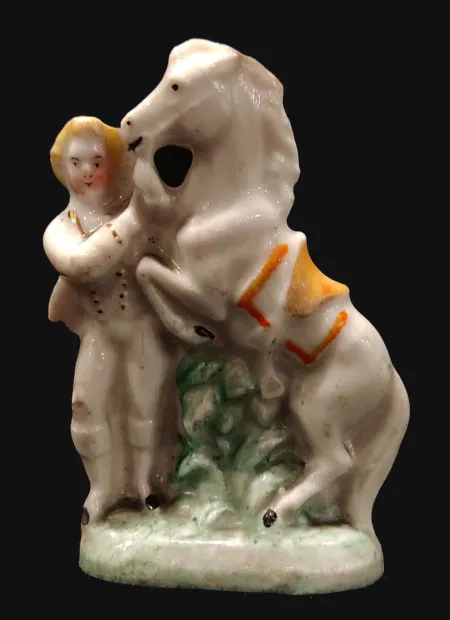 Staffordshire porcelain figure a boy with white horse